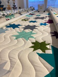 sternenquilt longarm blau wellenmuster